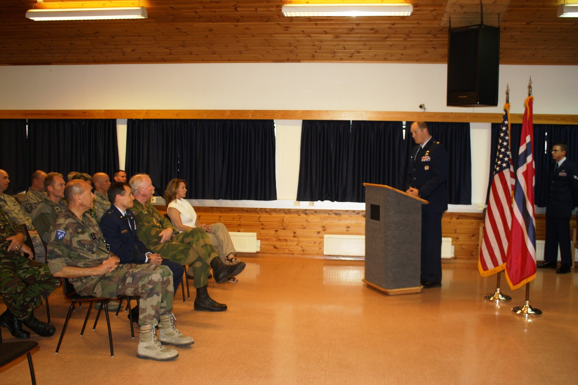 (Right) Maj. Peter Olsen, 426th Air Base Squadron commander, speaks to leadership from the NATO Joint Warfare Centre during a 9/11 Ceremony at Stavanger, Norway, Sept. 9. Approximately 80 NATO military and civilian personnel assigned to the JWC, as well as members of the 426th ABS, attended the event. (Courtesy photo)