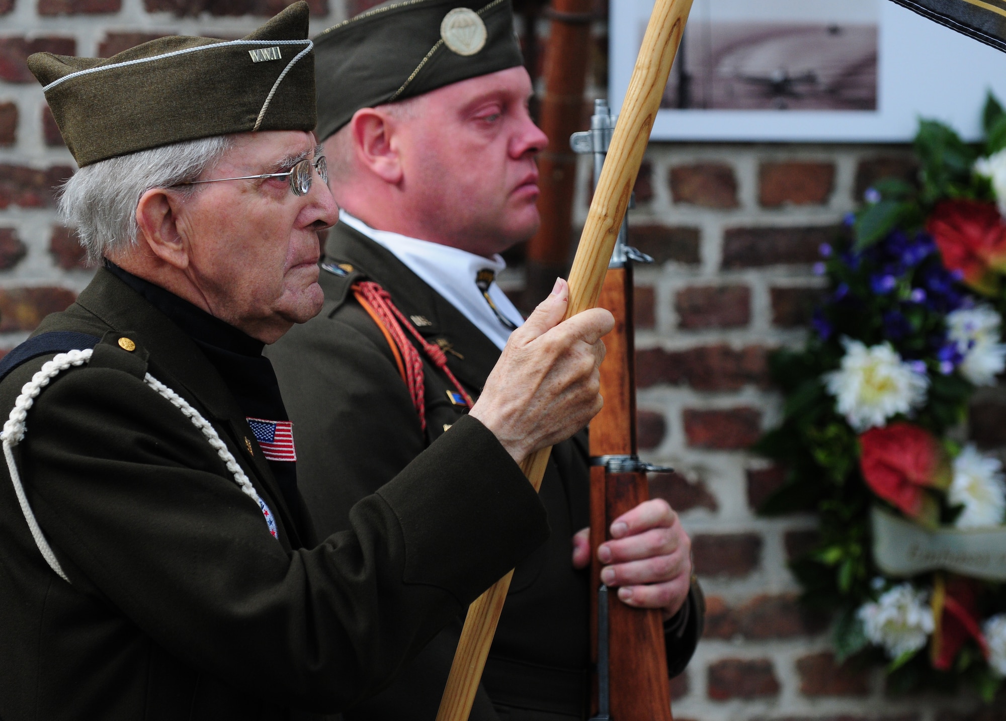 BORLO, Belgium – Maurice Sperandieu, a Belgian World War II veteran, left, and Frank De Rudder, World War II Honor Guard commander, stand at attention during a Belgian 9-11 memorial ceremony here Sept. 11. U.S. service members and Belgian World War II Honor Guard Team members, along with the local community, participated in this ceremony as part of the Belgian Open Monument Day in remembrance of the victims of the Sept. 11, 2001 terrorist attacks on the United States. (U.S. Air Force photo/Airman 1st Class Matthew B. Fredericks)