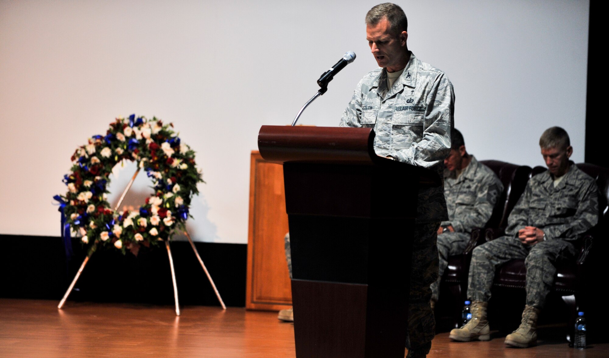 Chaplain (Col.) Dondi Costin, U. S. Air Forces Central Command chaplain, gives the invocation during a 9/11 remembrance ceremony Sept. 11, 2011, at an undisclosed location in Southwest Asia. (U.S. Air Force photo/Senior Airman Paul Labbe)