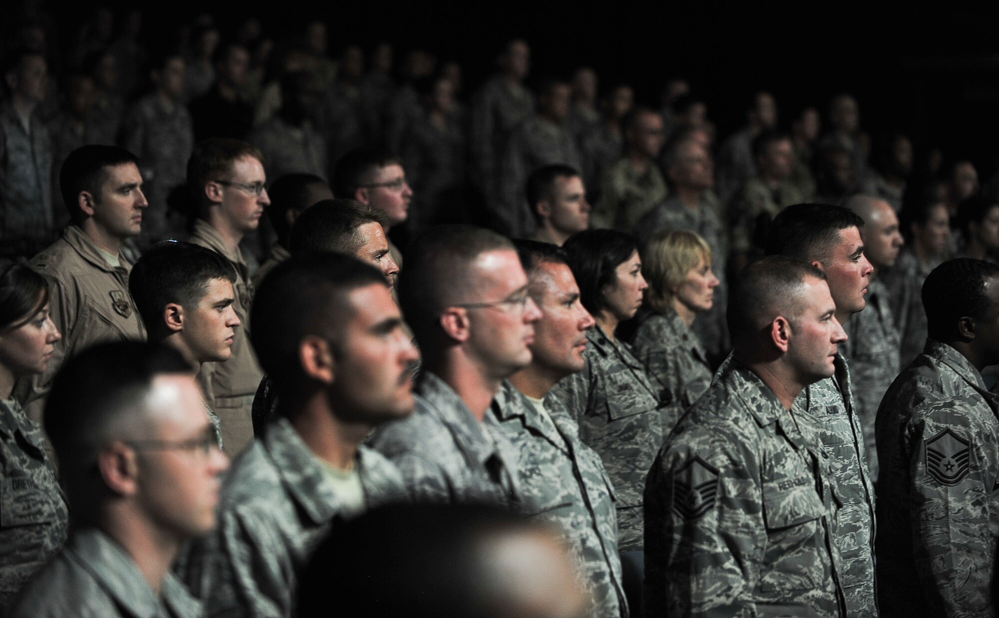 Audience members stand at attention during a ceremony to mark the tragic events of Sept. 11, 2001, at an undisclosed location in Southwest Asia. Members representing the United States, Australia, Canada, France and the United Kingdom attended the ceremony Sept. 11, 2011. (U.S. Air Force photo/Senior Airman Paul Labbe)