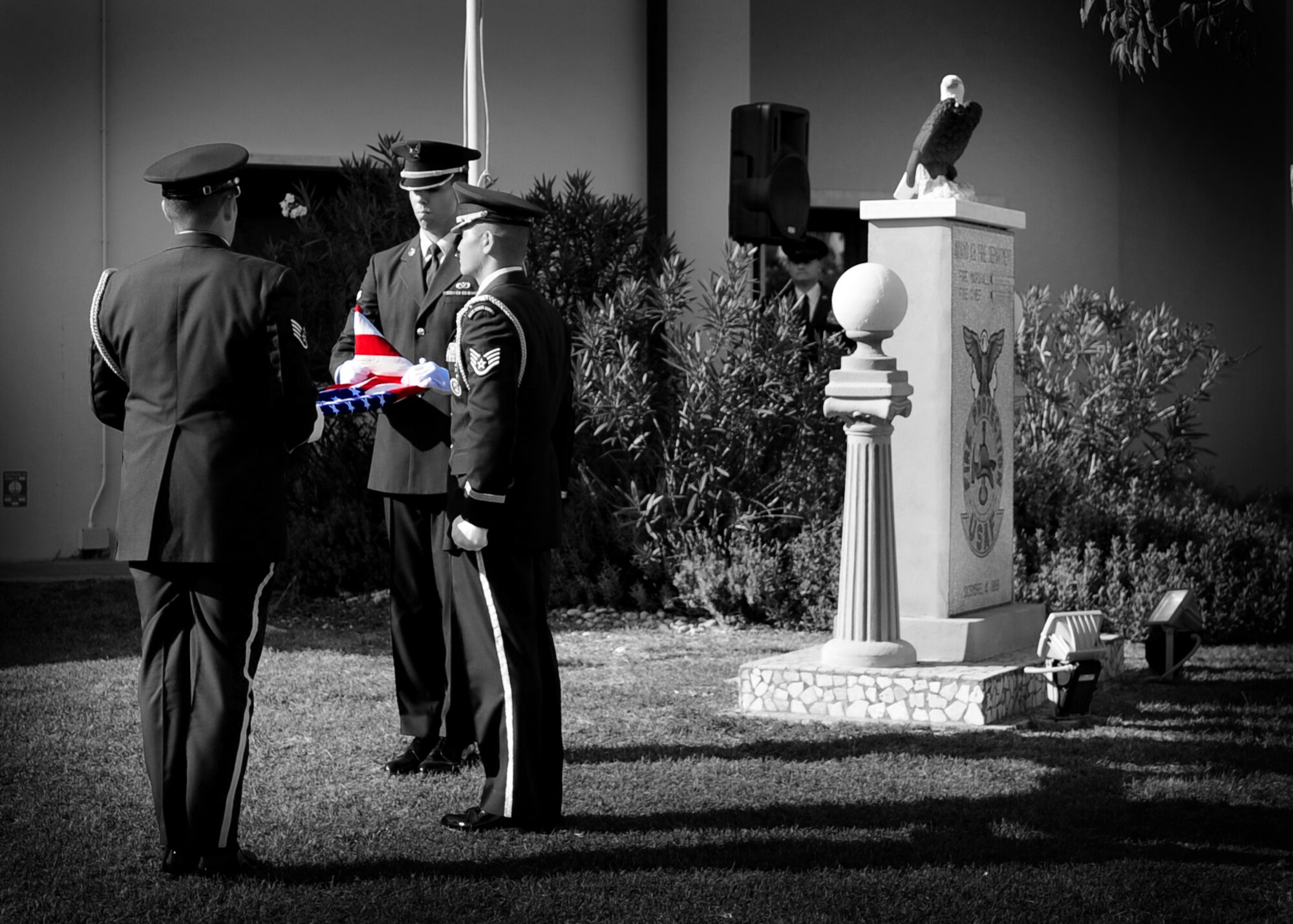 Members of the 31st Fighter Wing Honor Guard fold an American flag during a 9/11 commemoration ceremony Sept. 9 at the Fire department.  The ceremony commemorated the 10th anniversary of the Sept. 11, 2001 terrorist attacks that claimed the lives of nearly 3,000 innocent people at the World Trade Center, Shanksville, Penn., and Pentagon. (U.S. Air Force photo illustration/Senior Airman Evelyn Chavez)