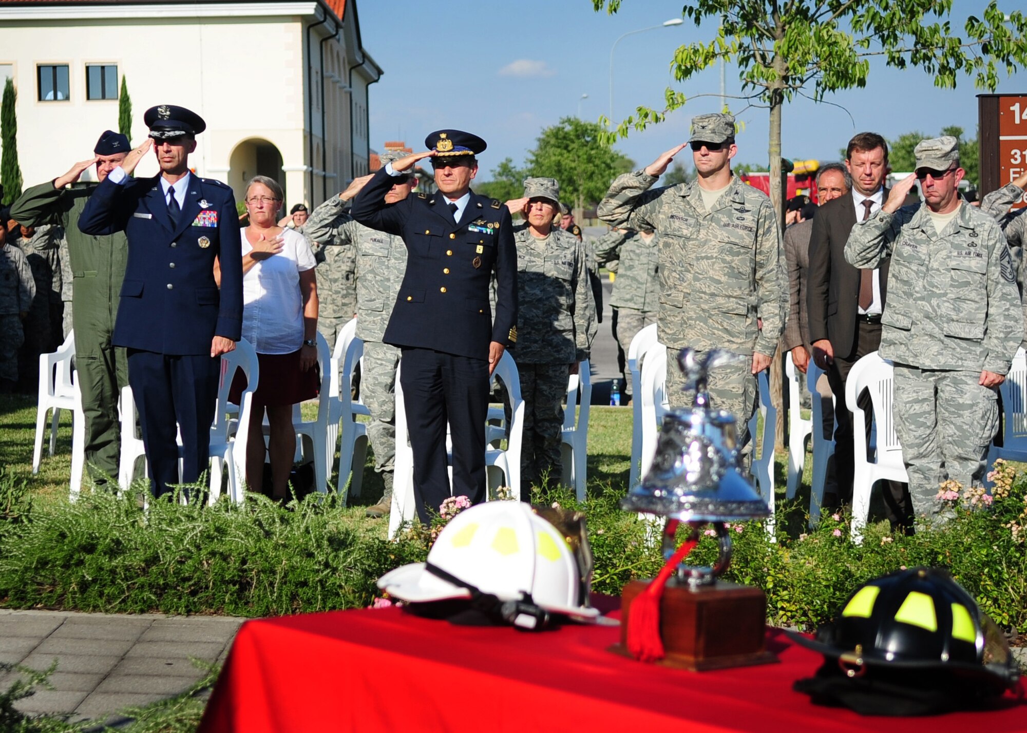 (L-R) Brig. Gen. Scott Zobrist, 31st Fighter Wing commander, Italian air force Col. Luca Cappelli, Pagliano e Gori commander, Colonel Dean Ostovich, 31st FW vice commander, and Chief Master Sgt. Jeffrey Craver, 31st FW command chief salute during the 9/11 ceremony Sept. 9 at the fire department.  The ceremony commemorated the 10th anniversary of the Sept. 11, 2001 terrorist attacks that claimed the lives of nearly 3,000 innocent people at the World Trade Center, Shanksville, Penn., and Pentagon.  (U.S. Air Force photo/Senior Airman Evelyn Chavez)
  