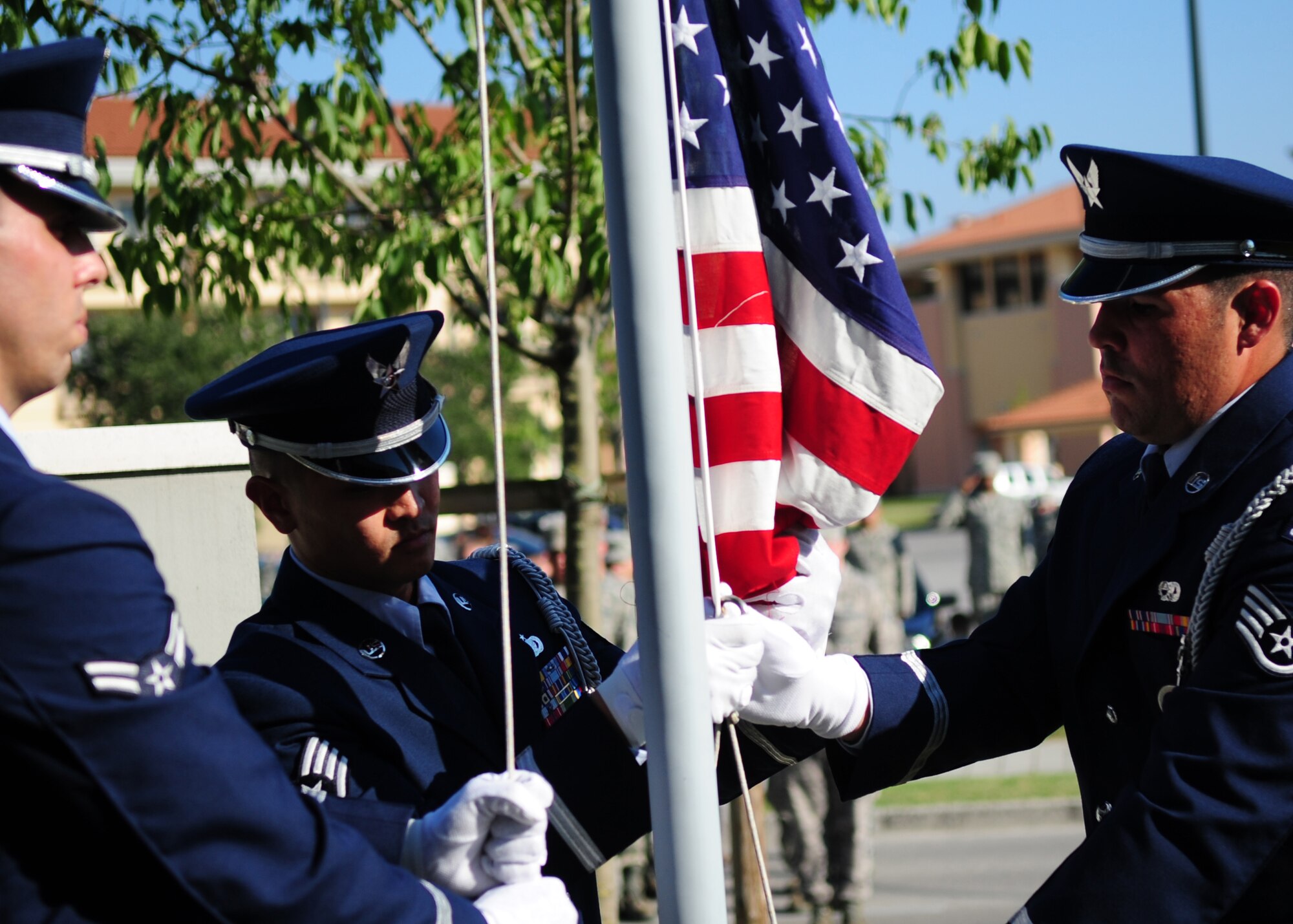 Members of the 31st Fighter Wing Honor Guard lower the American flag during a 9/11 commemoration ceremony Sept. 9 at the Fire department.  A ceremony was held in remembrance of the victims during the 9/11 attacks.  The ceremony commemorated the 10th anniversary of the Sept. 11, 2001 terrorist attacks that claimed the lives of nearly 3,000 innocent people at the World Trade Center, Shanksville, Penn., and Pentagon.  (U.S. Air Force photo/Senior Airman Evelyn Chavez)