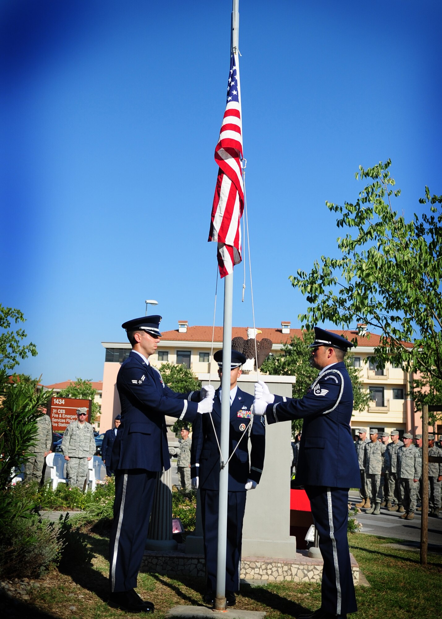 Members of the 31st Fighter Wing Honor Guard lower the American flag during a 9/11 commemoration ceremony Sept. 9 at the Fire department.  A ceremony was held in remembrance of the victims during the 9/11 attacks.  The ceremony commemorated the 10th anniversary of the Sept. 11, 2001 terrorist attacks that claimed the lives of nearly 3,000 innocent people at the World Trade Center, Shanksville, Penn., and Pentagon.  (U.S. Air Force photo/Senior Airman Evelyn Chavez)