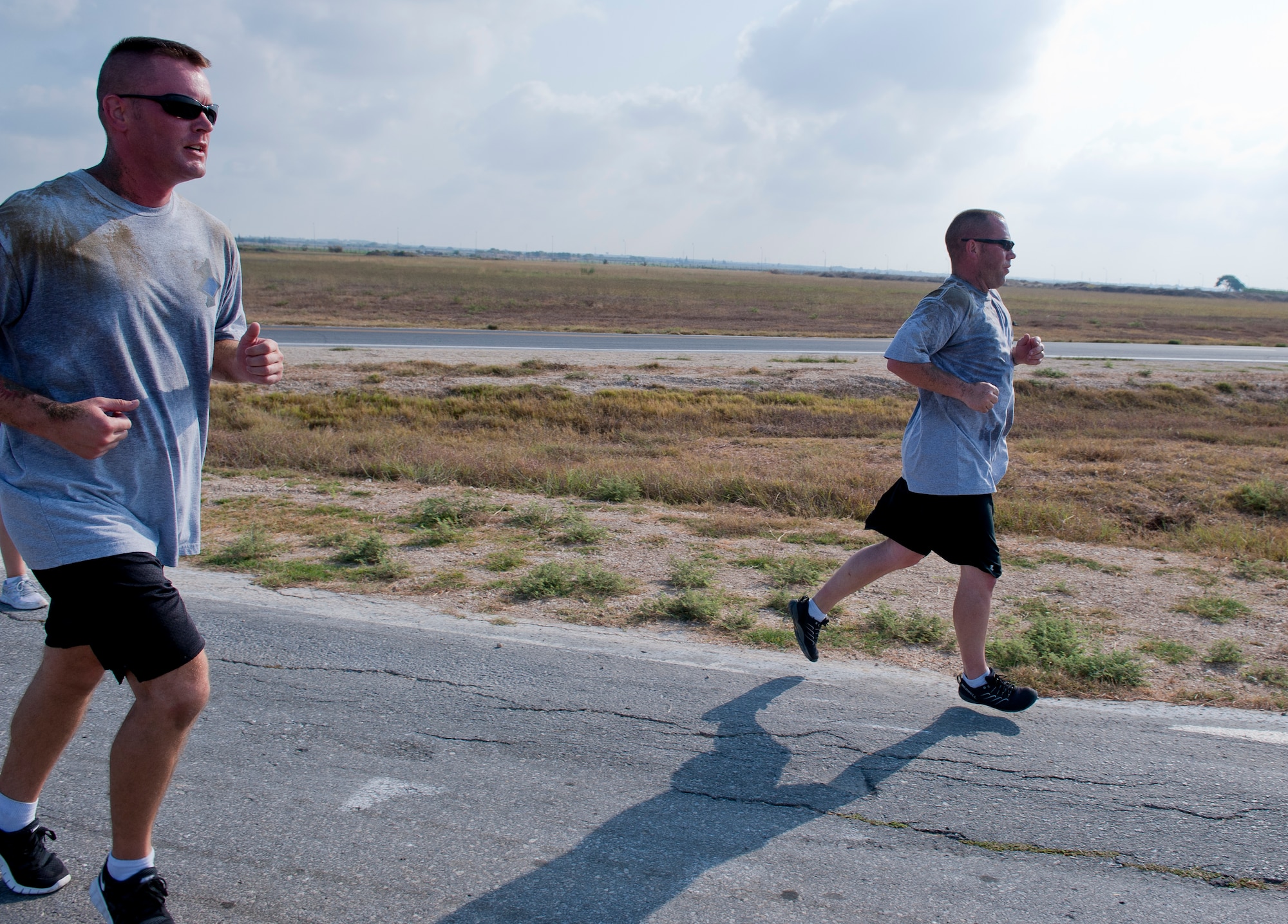 Master Sgt. Michael Mujwid, 39th Maintenance Squadron first sergeant, left, and Master Sgt. Aaron Smith, 39th MXS pro-shop superintendent, run during the 10th Anniversary of 9/11 Combat Endurance Challenge Sept. 10, 2011, at Incirlik Air Base, Turkey. The challenge contained six events including push-ups and sit-ups, sandbag carry, rucksack run, Airman's Manual test questions, litter carry and final sprint to the finish line. The 39th Logistical Readiness Squadron hosts the annual challenge to raise money for the National September 11 Memorial and Museum. (U.S. Air Force photo by Senior Airman Anthony Sanchelli)