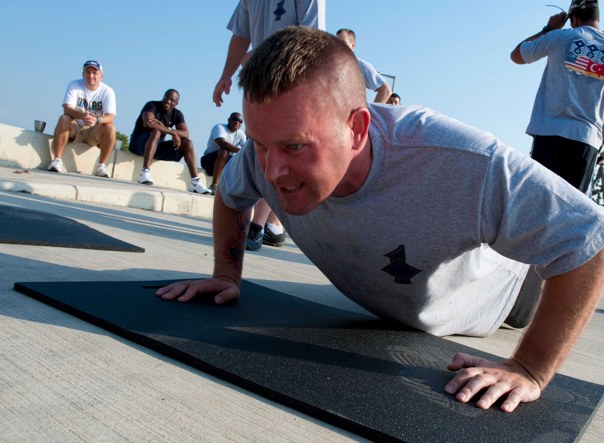 Master Sgt. Michael Mujwid, 39th Maintenance Squadron first sergeant, pumps out push-ups during the 10th Anniversary of 9/11 Combat Endurance Challenge Sept. 10, 2011, at Incirlik Air Base, Turkey. The challenge contained six events including push-ups and sit-ups, sandbag carry, rucksack run, Airman's Manual test questions, litter carry and final sprint to the finish line. The 39th Logistical Readiness Squadron hosts the annual challenge to raise money for the National September 11 Memorial and Museum. (U.S. Air Force photo by Senior Airman Anthony Sanchelli)