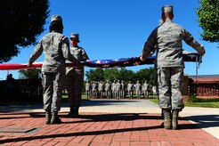 Members of the Joint Base Honor Guard fold the American flag during a Retreat ceremony Sept. 9 at JB CHS - Air Base, commemorating the 10th anniversary of the 9/11 attacks, (U.S. Air Force photo/Airman 1st Class Jodi Martinez) 

