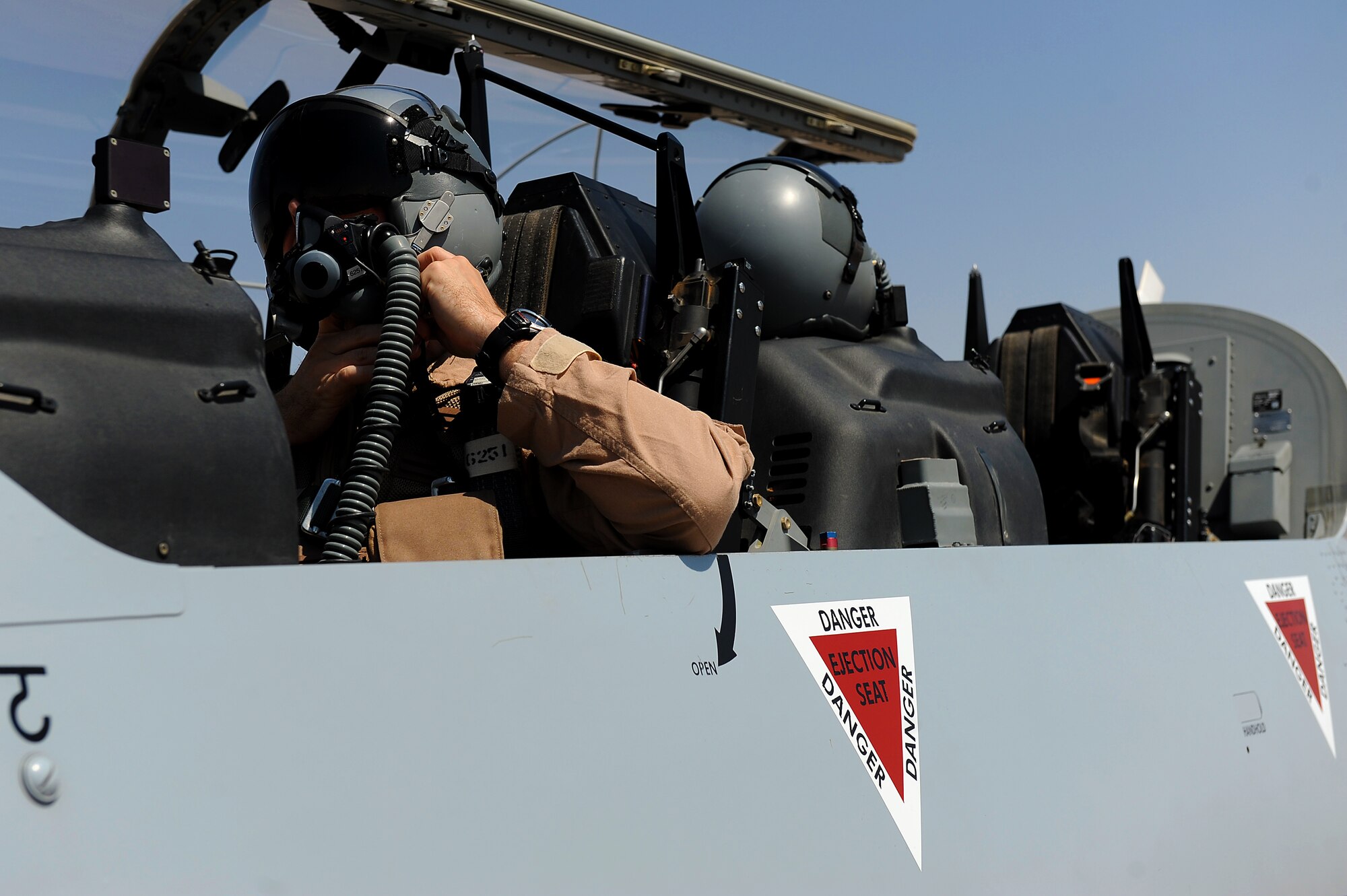 Maj. Kent Bolster, 52nd Expeditionary Flying Training Squadron instructor pilot and an Iraqi air force pilot straps in to a T-6 Texan II for flight training Sept. 4, 2011, at Camp Speicher, Iraq. The 52nd EFTS turned over flight operations to the IqAF Sept. 5. The T-6 is a single-engine, two-seater designed to train joint primary pilot training students in basic flying skills common to U.S. Air Force and Navy pilots, including six other countries.  (U.S. Air Force photo/Staff Sgt. Mike Meares)