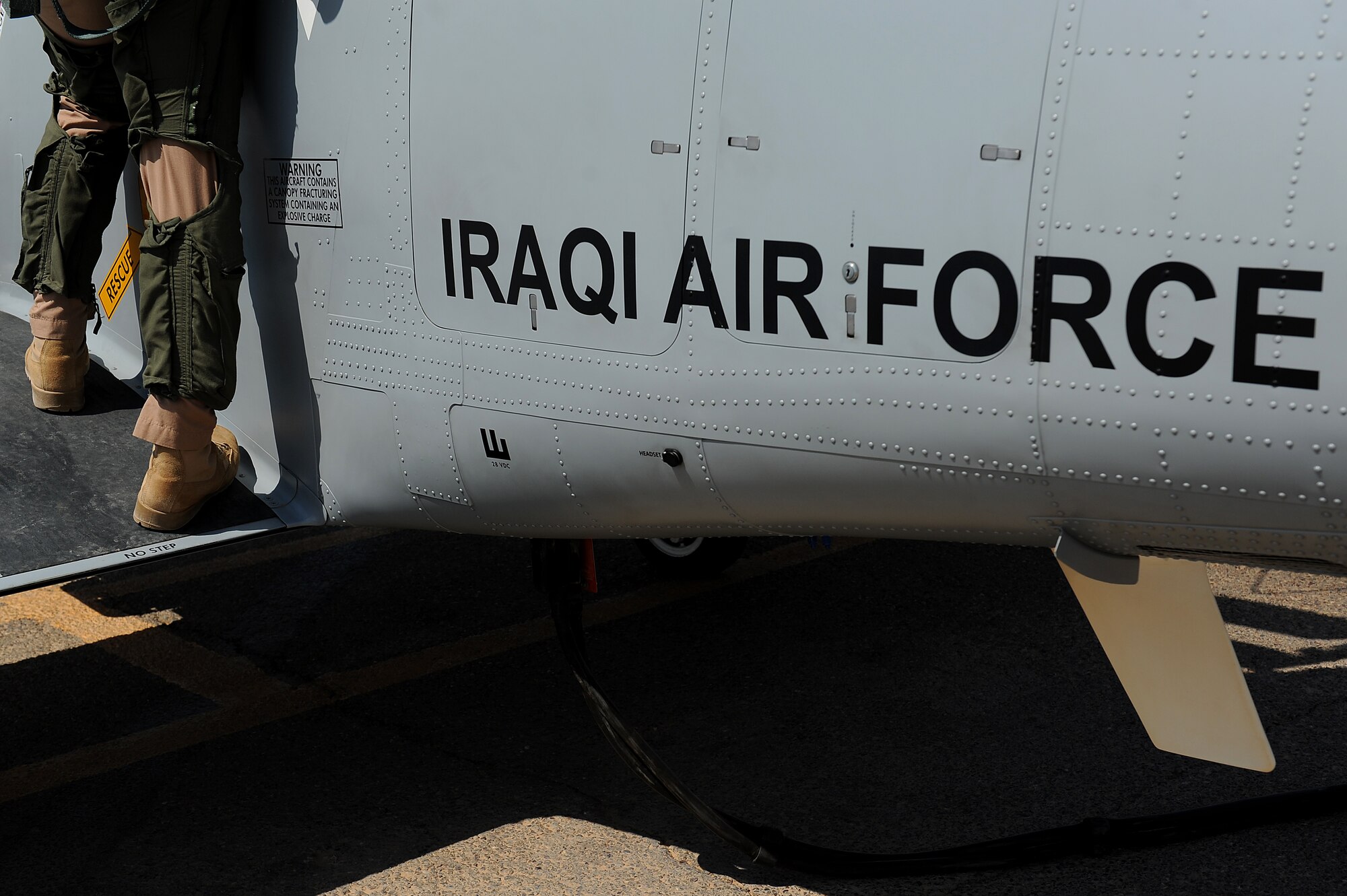 An Iraqi air force pilot prepares for flight training operations in a T-6 Texan II Sept. 4, 2011, at Camp Speicher, Iraq. The 52nd EFTS turned over flight operations to the IqAF Sept. 5. The T-6 is a single-engine, two-seater designed to train joint primary pilot training students in basic flying skills common to U.S. Air Force and Navy pilots, including six other countries.  (U.S. Air Force photo/Staff Sgt. Mike Meares)