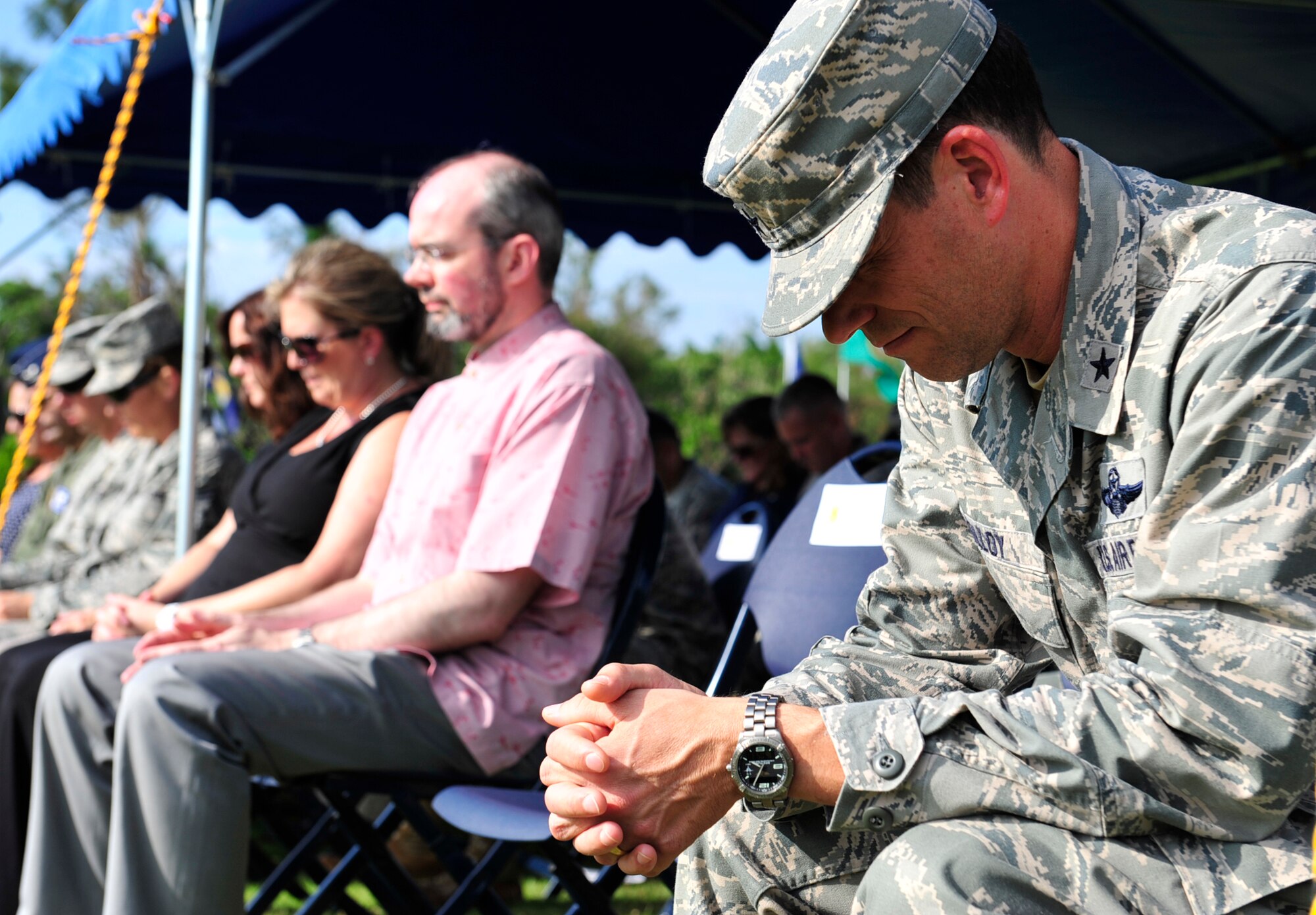 (Far Right) Brig. Gen. Matt Molloy, 18th Wing commander, lowers his head in prayer during the 9/11 Remembrance Ceremony held at the 18th Wing headquarters building, Kadena Air Base, Japan Sept. 9. Members of Team Kadena and the local community were in attendance at the tenth anniversary of the terrorist attack on the Twin Towers and the Pentagon. (U.S. Air Force photo/ Tech. Sgt. Lakisha A. Croley)