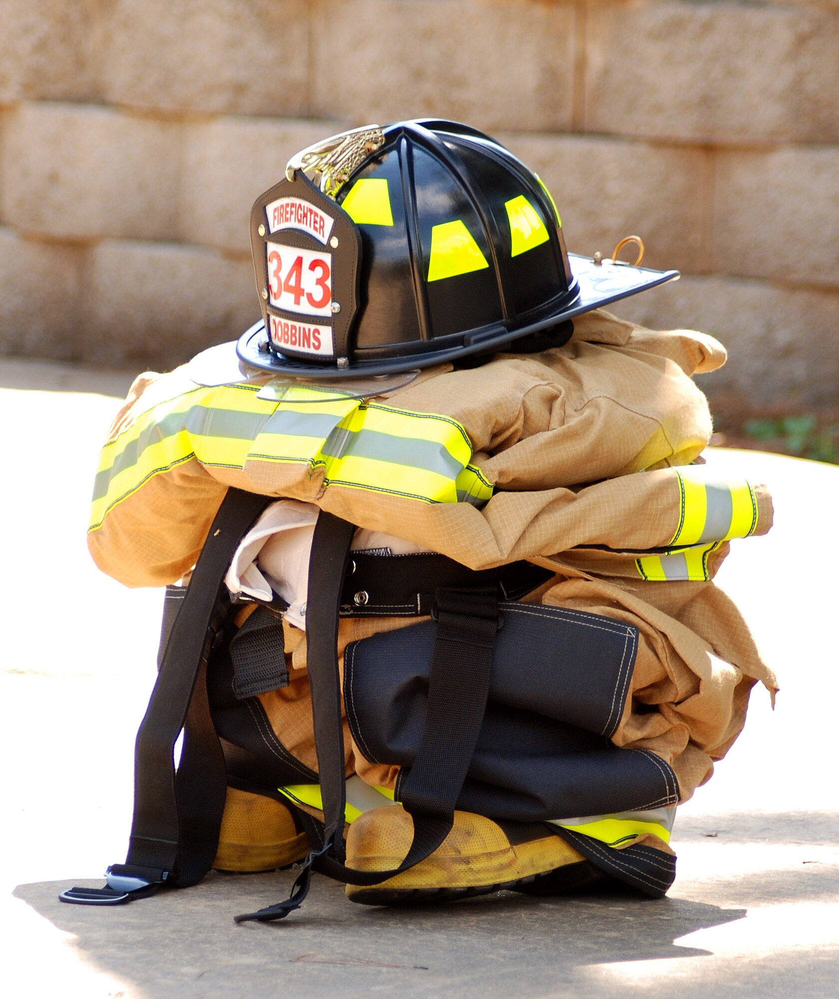 Firefighters equipment is positioned at the retreat ceremony  in honor of the New York firefighters who lost their lives on Sept. 11, 2001.   (U.S. Air Force photo/ Master Sgt. Stanley Coleman)