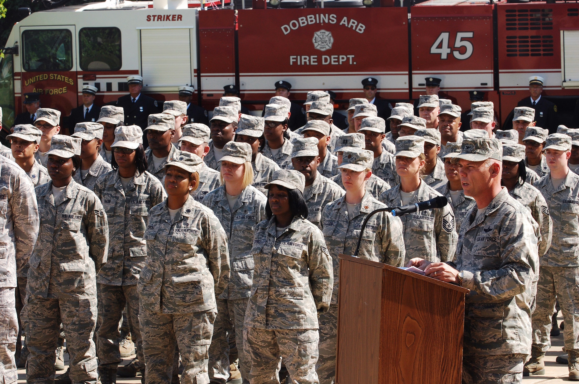 Col. Richard Kemble, 94th Airlift Wing vice commander, talks about those who were lost on Sept 11, 2001 and the impact the events of that day have had on the world, during a retreat ceremony at Dobbins Air Reserve Base to honor the 10th anniversary of the 2001 terrorist attacks, Sept 11.   (U.S. Air Force photo/ Brad Fallin)