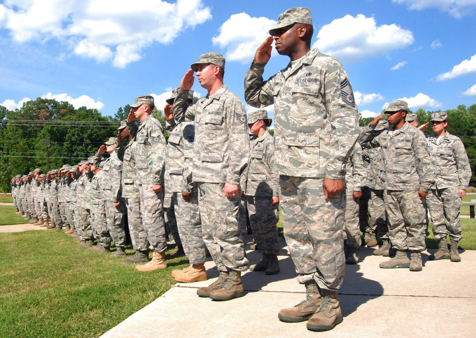Airmen of the 94th Airlift Wing, Dobbins Air Reserve Base, salute the U.S. flag at the retreat ceremony to honor the 10th anniversary of the 2001 terrorist attacks, Sept 11.   (U.S. Air Force photo/ Senior Airman Christina Bozeman)