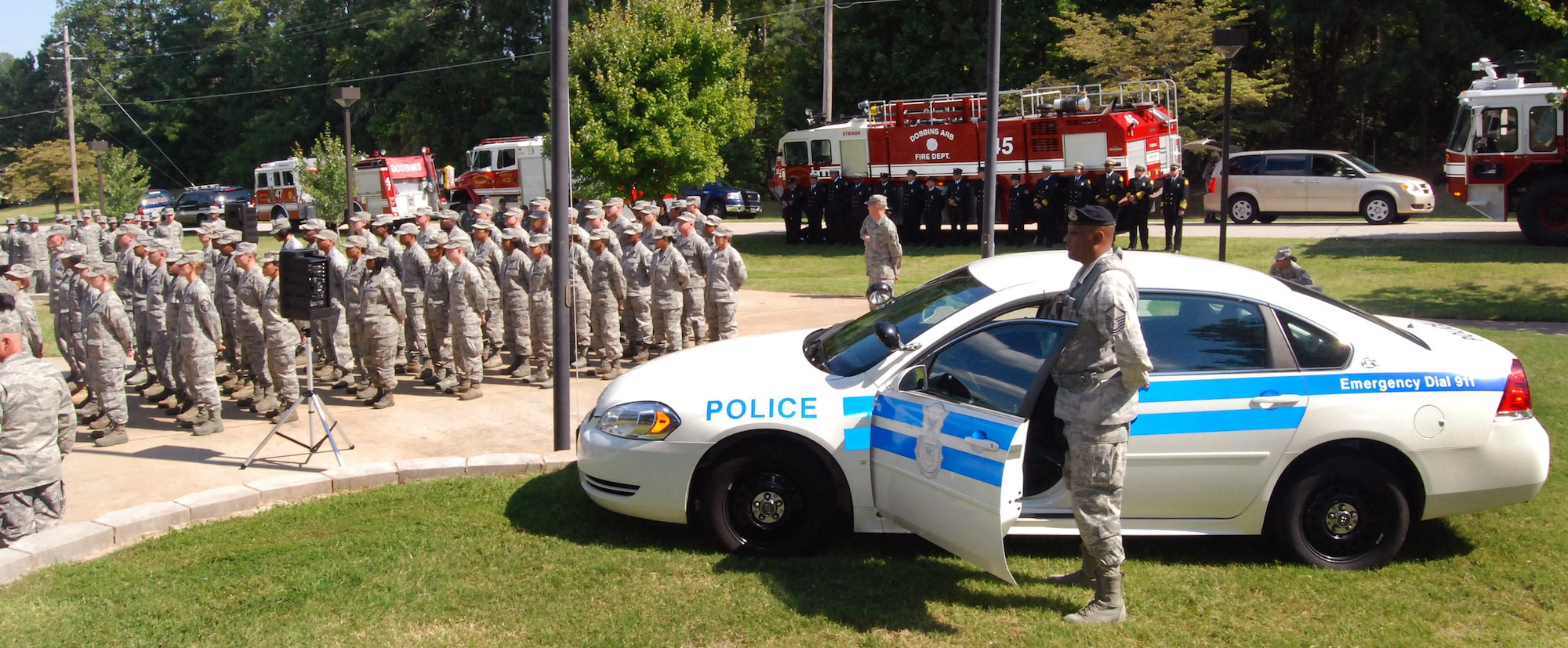 Police, firefighters, and other Airmen from around the 94th Airlift Wing are in attendance at the retreat ceremony to honor the 10th anniversary of the 2001 terrorist attacks, Sept 11.   (U.S. Air Force photo/ Senior Airman Christina Bozeman)