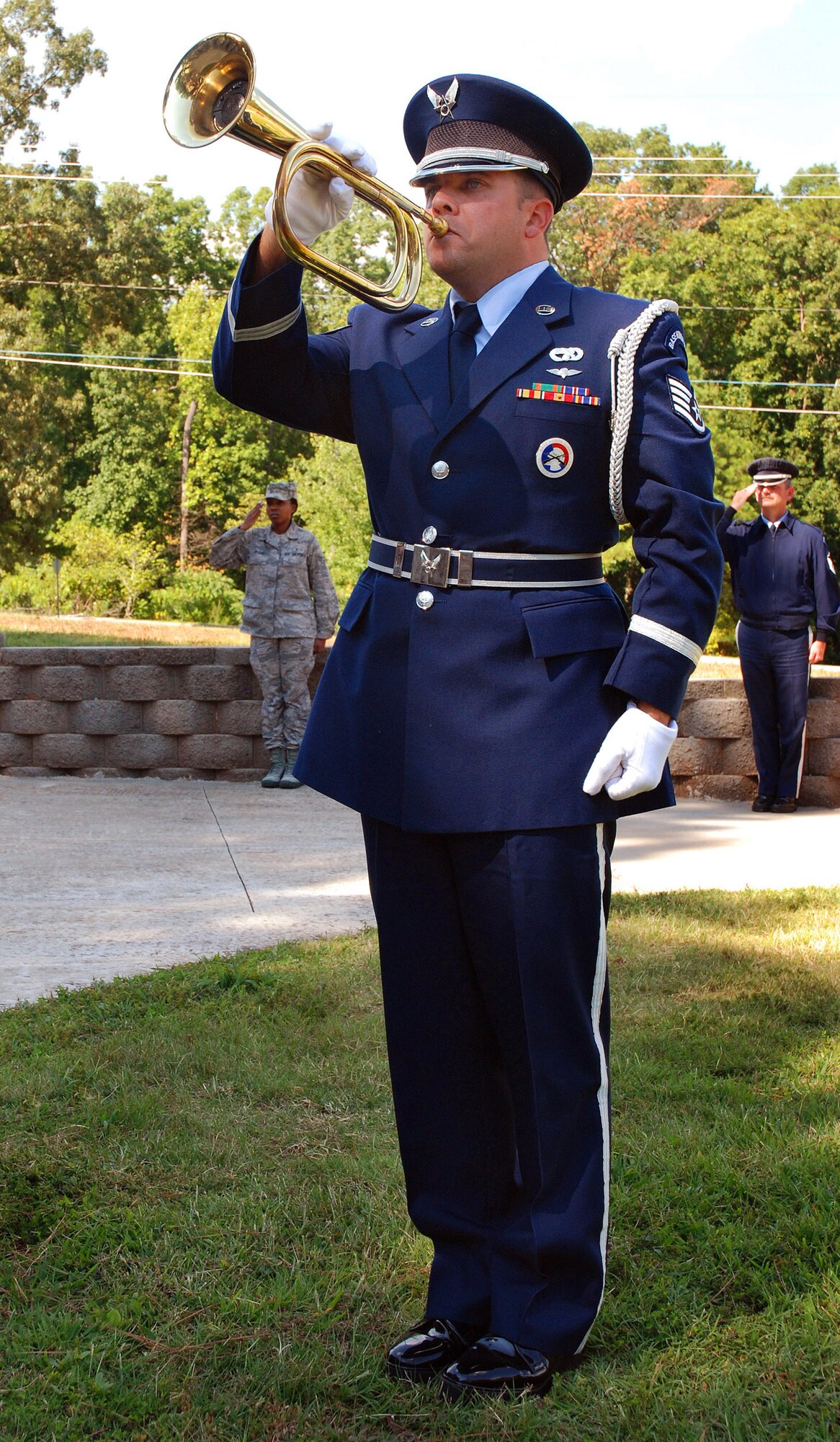 Staff Sgt. Aaron Abshire, 94th Airlift Wing Honor Guard bugler, plays Taps during a retreat ceremony at Dobbins Air Reserve Base to honor the 10th anniversary of the 2001 terrorist attacks, Sept 11.   (U.S. Air Force photo/ Senior Airman Spencer Gallien)