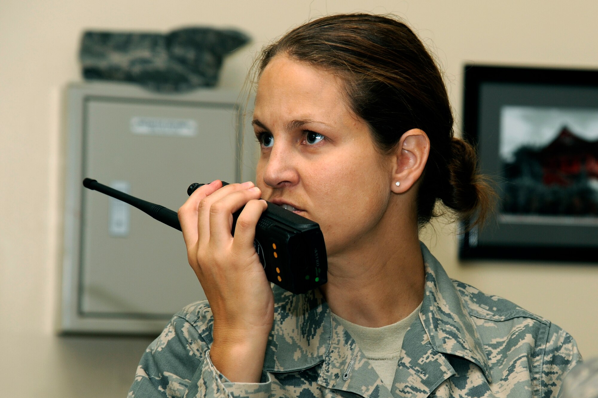 MISAWA AIR BASE, Japan - Tech. Sgt. Laura Andrews, 35th Aerospace Medicine Squadron, radios to entry team for information during a biological response exercise at building 99 here Sept. 12. The teams objective was to collect, label, bag and analyze liquid and powder samples. (U.S. Air Force photo/Tech. Sgt. Marie Brown)