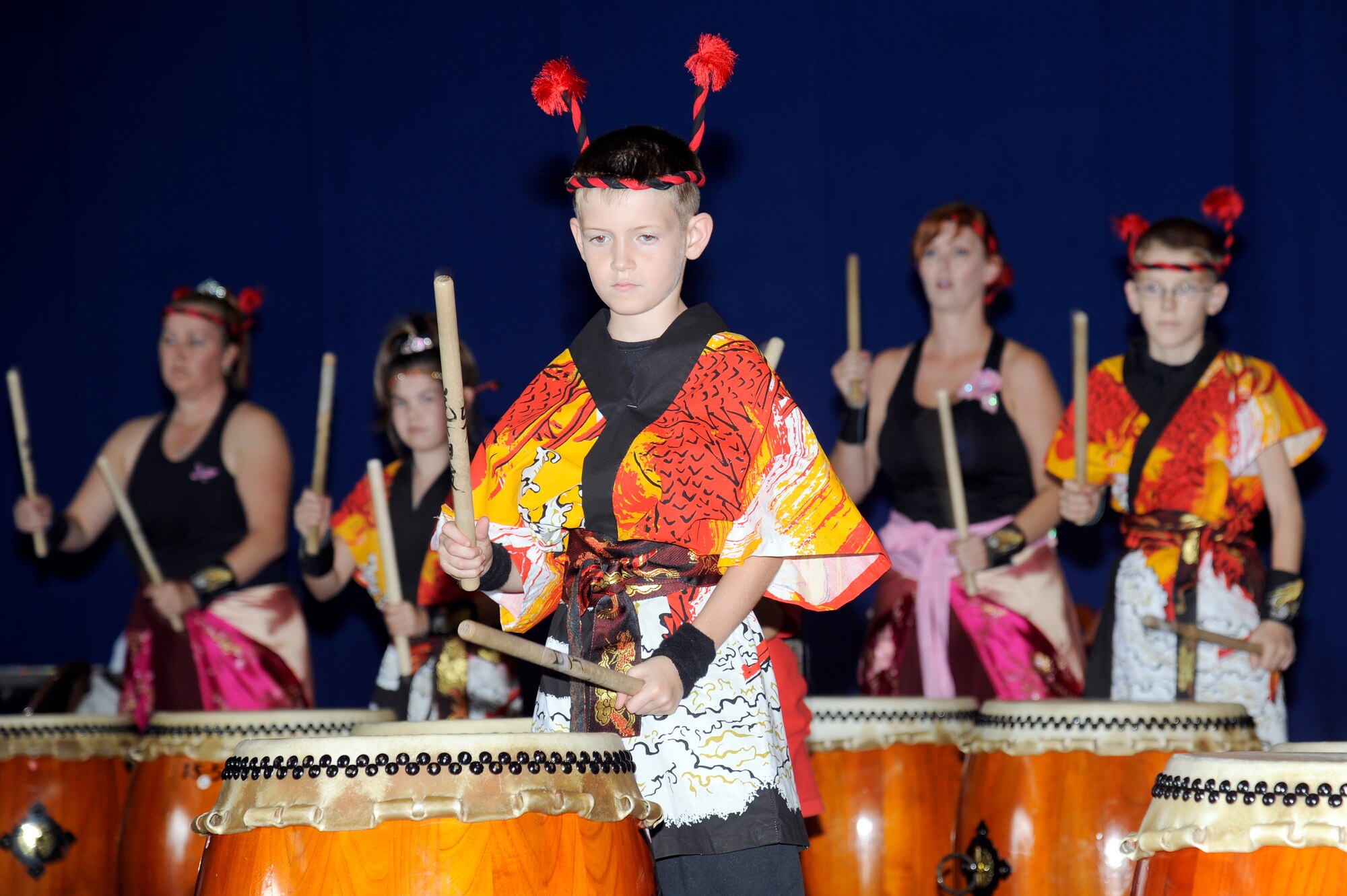 MISAWA AIR BASE, Japan - The Dragon Eagle Taiko team performs for athletes and volunteers in Hangar 949 during the annual Special Olympics here Sept. 10. Other performers were the Ichigo Ichie Band, Bondolo King Band and Team Misawa Dancers. (U.S. Air Force photo/Tech. Sgt. Marie Brown)