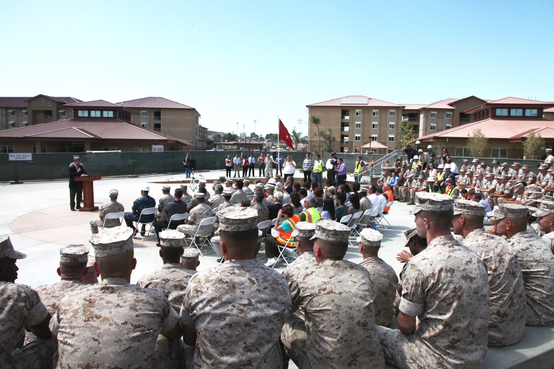 Pete LeClair, operations manager, Hensel and Phelps Construction Company, speaks during a ribbon cutting ceremony, marking the completion of the new bachelor enlisted quarters in 14 Area, Camp Pendleton, Calif., Sept. 12. The BEQ complex was designed to give Marines a facility they could call home.