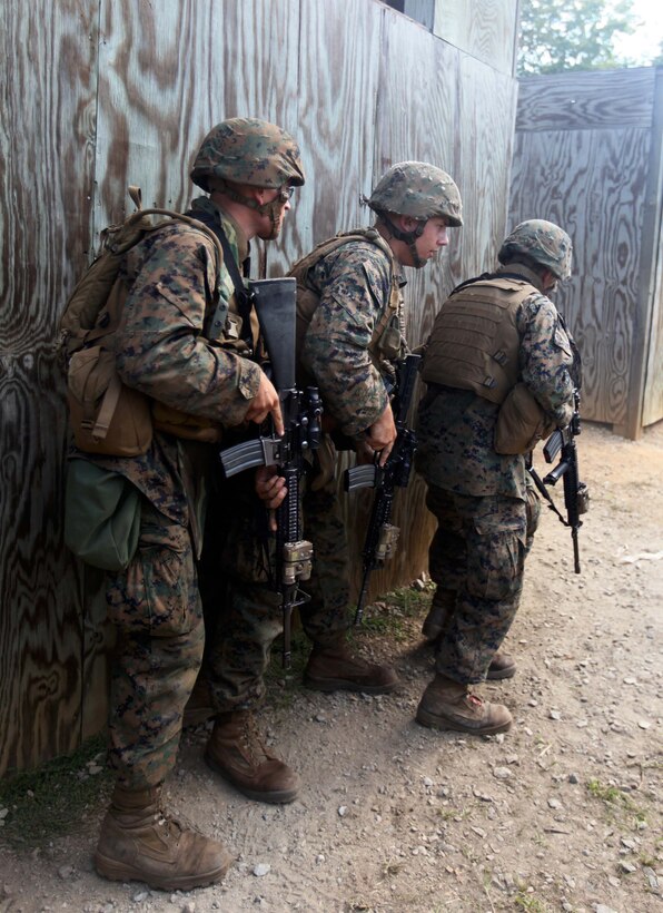 Marines and sailors of 3rd Platoon, Charlie Company, 1st Battalion, 2nd Marine Regiment, conduct Military Operations in Urban Terrain training at the Urban Assault Course on Fort Pickett, Va., Sept. 12, 2011. More than 900 Marines and Sailors are taking part in the Deployment for Training exercise at Fort Pickett, Sept. 6-23. The battalion is scheduled to attach to the 24th Marine Expeditionary Unit as its Battalion Landing Team a few days after the training.