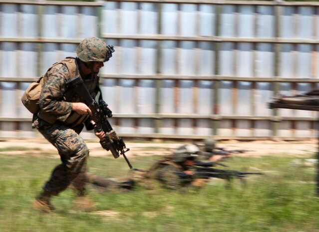 Marines and Sailors of 3rd Platoon, Charlie Company, 1st Battalion, 2nd Marine Regiment, conduct Military Operations in Urban Terrain training at the Urban Assault Course on Fort Pickett, Va., Sept. 12, 2011. More than 900 Marines and sailors are taking part in the Deployment for Training exercise at Fort Pickett, Sept. 6-23. The battalion is scheduled to attach to the 24th Marine Expeditionary Unit as its Battalion Landing Team a few days after the training.