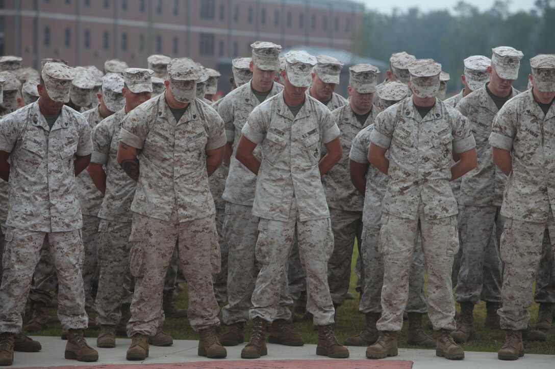 Marines with U.S. Marine Corps Forces, Special Operations Command bow their heads in prayer during a 9/11 memorial ceremony at MARSOC headquarters aboard Camp Lejeune, N.C. Sept.12. September was a month of rememberance and reflection, marked by several ceremonies taking place throughout MARSOC to honor its fallen warriors and the victims of 9/11.