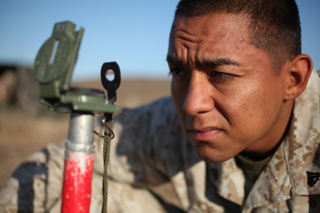 Squad leader Cpl. Luis A. Lerma with 81mm mortar platoon, Weapons Company, Battalion Landing Team 3/1, prepares for a live-fire exercise here Sept. 11. The battalion is the ground combat element for the 11th Marine Expeditionary Unit, which is conducting its second sea-based exercise since becoming a complete Marine air-ground-task force in May. Lerma is a 25-year-old Murrieta, Calif., native.::r::::n::