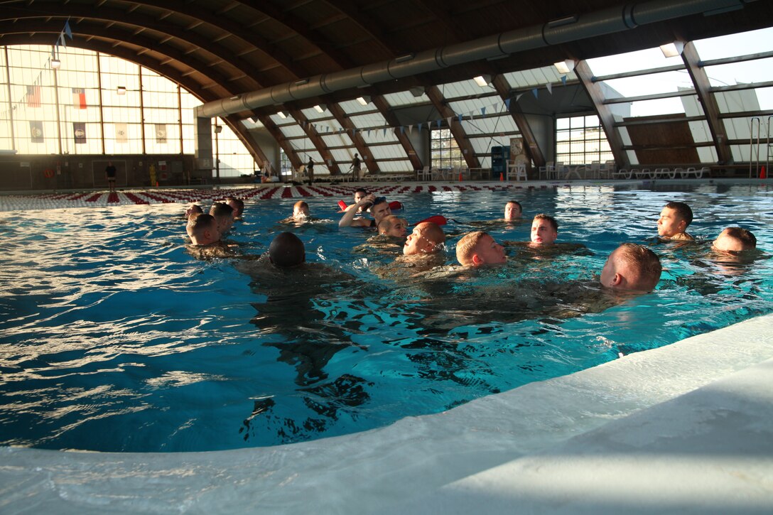 The new Marine swim qualification system was adjusted to provide updated, safer and expeditionary force relevant water survival training Sept 13. In the new swim qualification basic Marines were required to tread water for four minutes, where they stayed afloat using only their gear and without using the edge of the pool