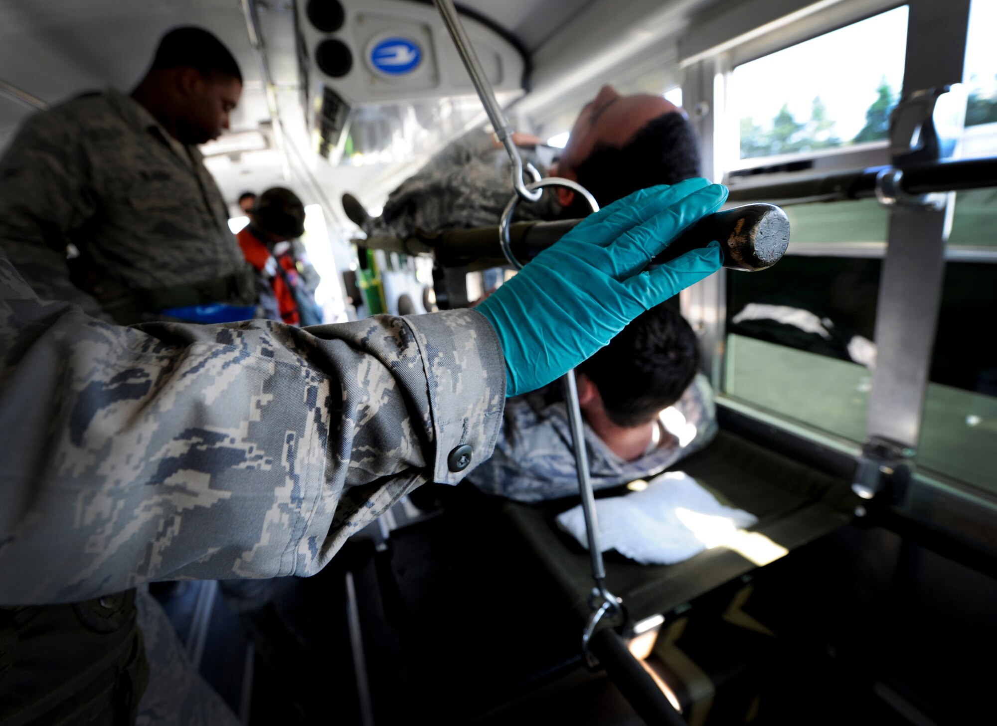 YOKOTA AIR BASE, Japan – Airmen from the 374th Medical Operations Squadron prepare and transport patients on litters during a simulated medical evacuation at Yokota Air Base, Japan, Sept. 13, 2011. Yokota is participating in a wing readiness exercise. (U.S. Air Force photo/Staff Sgt. Stacy Moless)