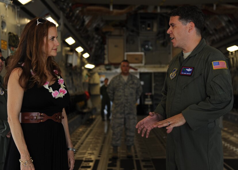 JOINT BASE PEARL HARBOR HICKAM, Hawaii – Tech. Sgt. Mark Shertzer, 15th Operation Support Squadron, gives actress Kelly Preston a tour of the C-17 Globemaster III during a Pacific Air Forces orientation here, Sept. 13, 2011. Preston visited to learn more about the PACAF mission and recent humanitarian support provided to Japan during Operation Tomodachi. Preston was born and raised in Hawaii and is a graduate of Punahou School. (U.S. Air Force photo/Staff Sgt. Gustavo Gonzalez)