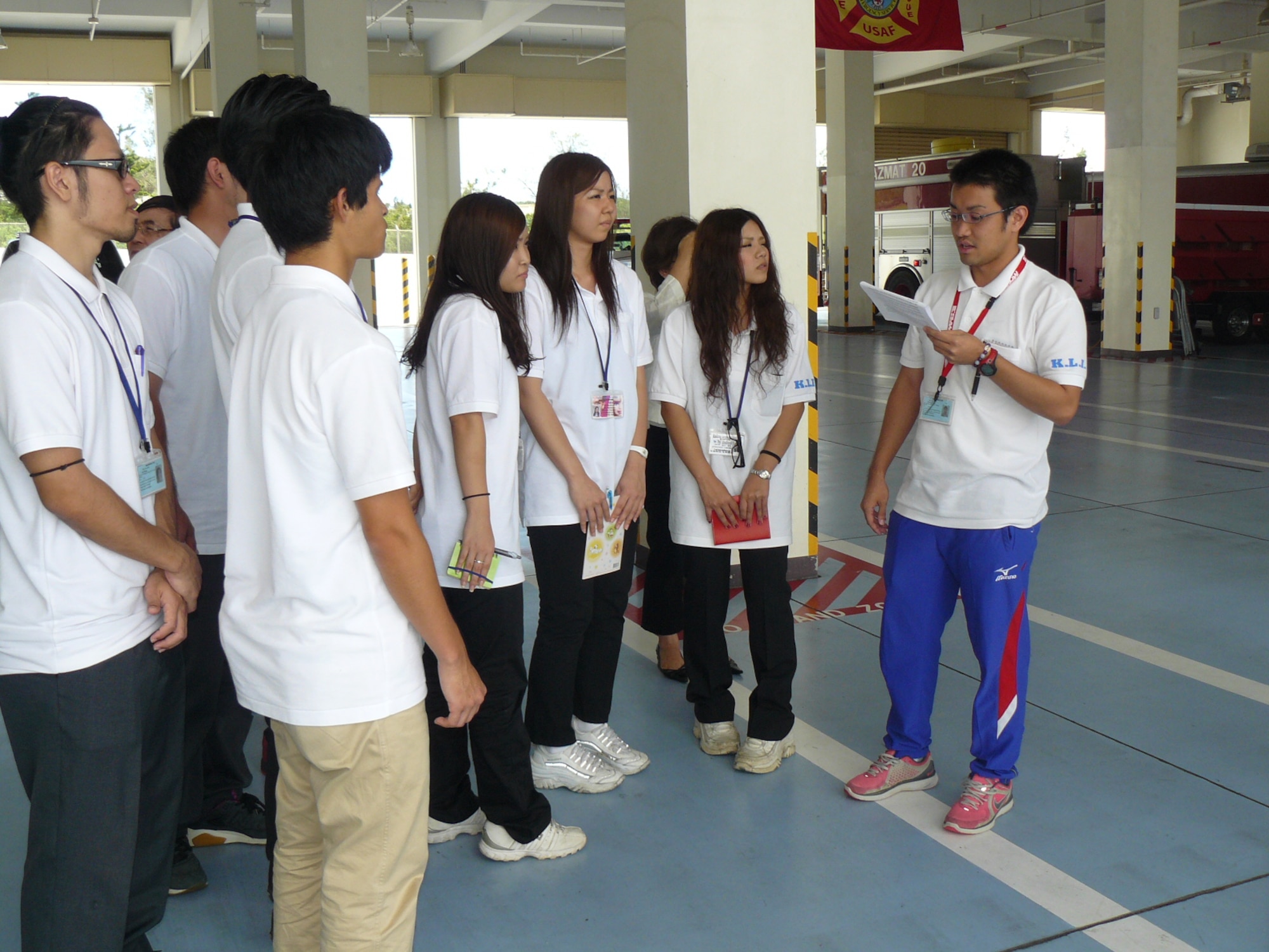 Takashi Umeki, Kadena Language Institute intern, briefs visiting first-year KLI students on operations at the fire station on Kadena Air Base, Japan, during the August to September KLI internship here. The internship program, instituted more than 12 years ago, is aimed at helping the second-year students of KLI gain confidence and proficiency in their English-speaking skills. (Courtesy photo/Kadena Language Institute)