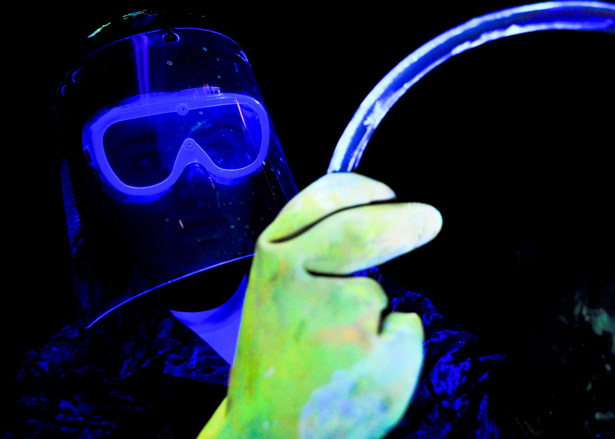 Airman 1st Class Nicole Calungsod, 51st Maintenance Squadron nondestructive inspection technician, examines an aircraft part under an ultraviolet light during an inspection Sept. 13, 2011. NDI is the examination of aerospace weapon systems components and support equipment for structural integrity using nondestructive inspection methods and fluid analysis.  (U.S. Air Force Photo by/ Senior Airman Adam Grant))