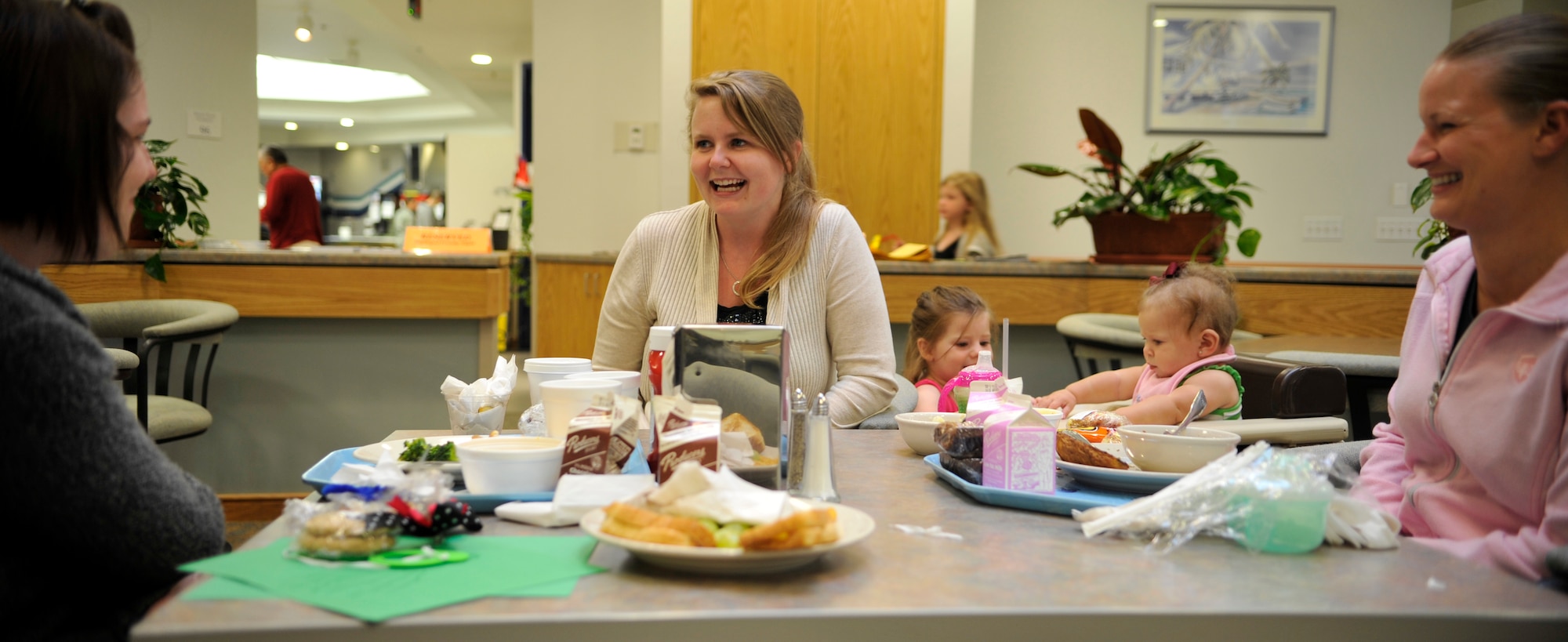 VANDENBERG AIR FORCE BASE, Calif. -- Dependents and their family members eat dinner at a Global Hearts Group Family Night Out event at Breakers Dining Facility here Thursday, Aug. 25, 2011.  The Global Hearts Group supports deployed military members and their dependents with donated and purchased items supplied at the Airman and Family Readiness Center. (U.S. Air Force photo/Staff Sgt. Andrew Satran) 

   