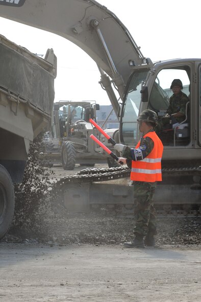 TAEGU AIR BASE, Republic of Korea -- Republic of Korea Air Force 11th Civil Engineer Squadron members participate in the 2011 Combined Airfield Damage Repair Exercise with Airmen from the 8th Civil Engineer Squadron here Sept. 8. The purpose of the exercise was to enhance interoperability, evaluate capabilities and strengthen combined relationships between U.S. and ROKAF members. (U.S. Air Force photo/Senior Airman Brittany Y. Bateman)