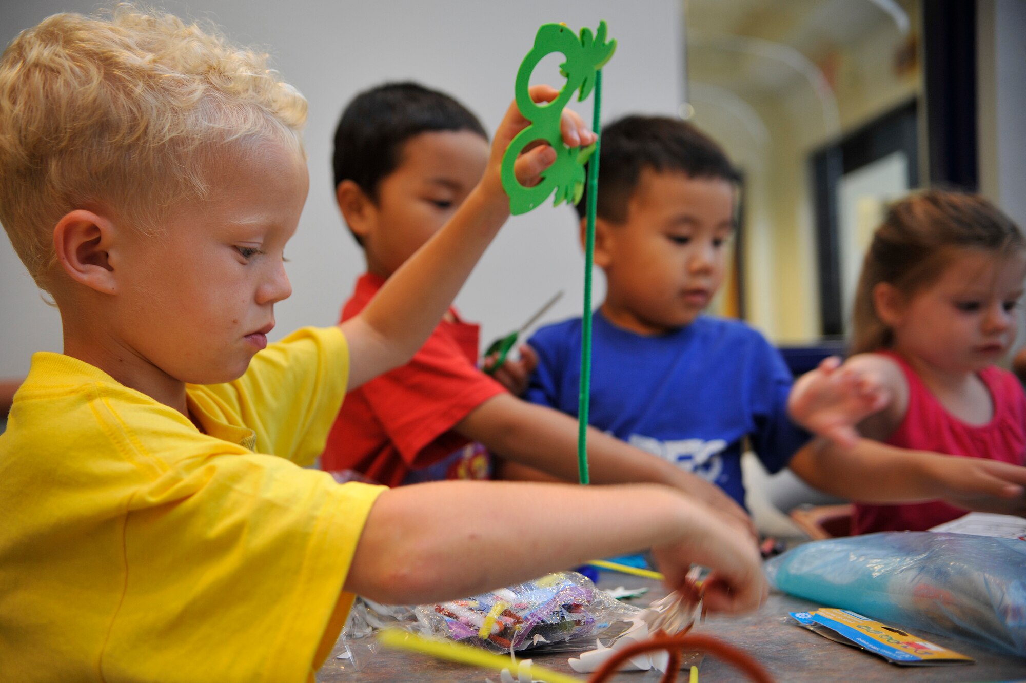 VANDENBERG AIR FORCE BASE, Calif. -- Dependents of deployed Vandenberg members create masks at a Global Hearts Group Family Night Out event at Breakers Dining Facility here Thursday, Aug. 25, 2011.  (U.S. Air Force photo/Staff Sgt. Andrew Satran) 

 