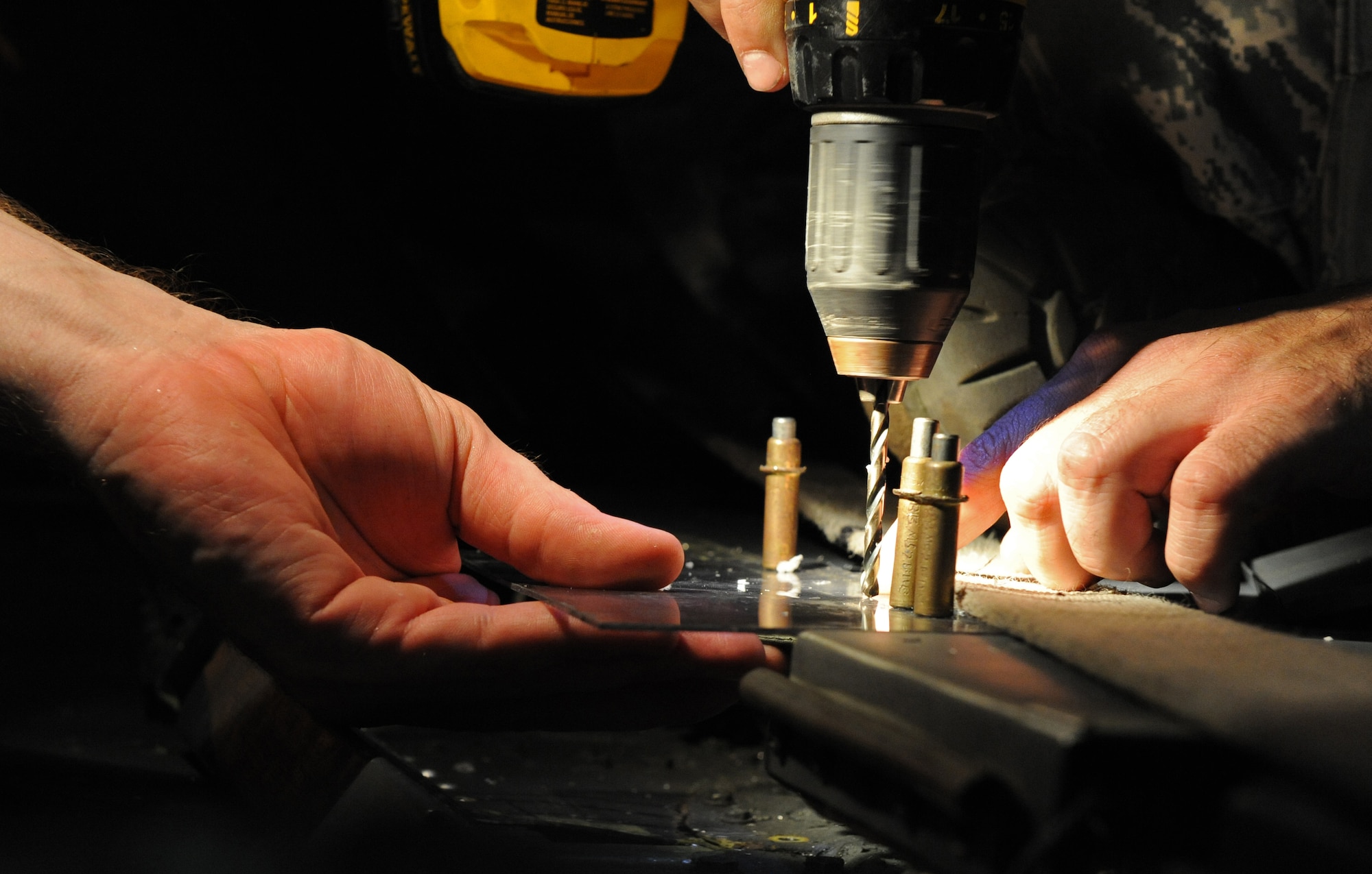 Staff Sgt. Joshua Partin, 2nd Maintenance Squadron Fabrication Flight, drills a hole into a spoiler gap cover on a B-52H Stratofortress on Barksdale Air Force Base, La., Sept. 12. Airmen from the fabrication flight repair or replace sheet metal and fix loose rivets and cracks on the B-52 aircraft. (U.S. Air Force photo/Airman 1st Class Micaiah Anthony)(RELEASED)