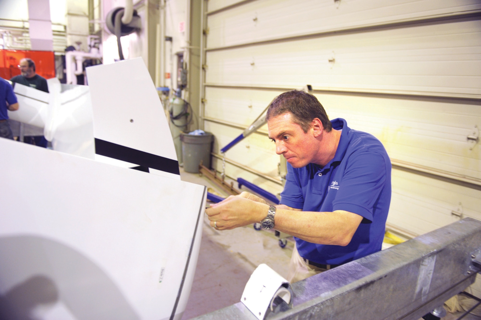 Dr. Stefan Siegel seals a pylon before initial water tests. (U.S. Air Force Photo/John Van Winkle)