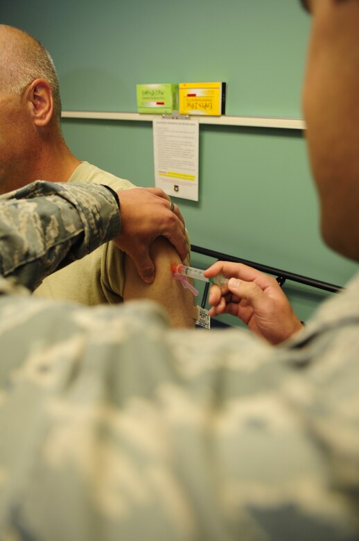 VANDENBERG AIR FORCE BASE, Calif. – Col. Richard Boltz, the 30th Space Wing commander, receives the influenza vaccine at the medical clinic here Tuesday, Sept. 13, 2011. The influenza vaccine is available to all active-duty members. (U.S. Air Force photo/Senior Airman Lael Huss)