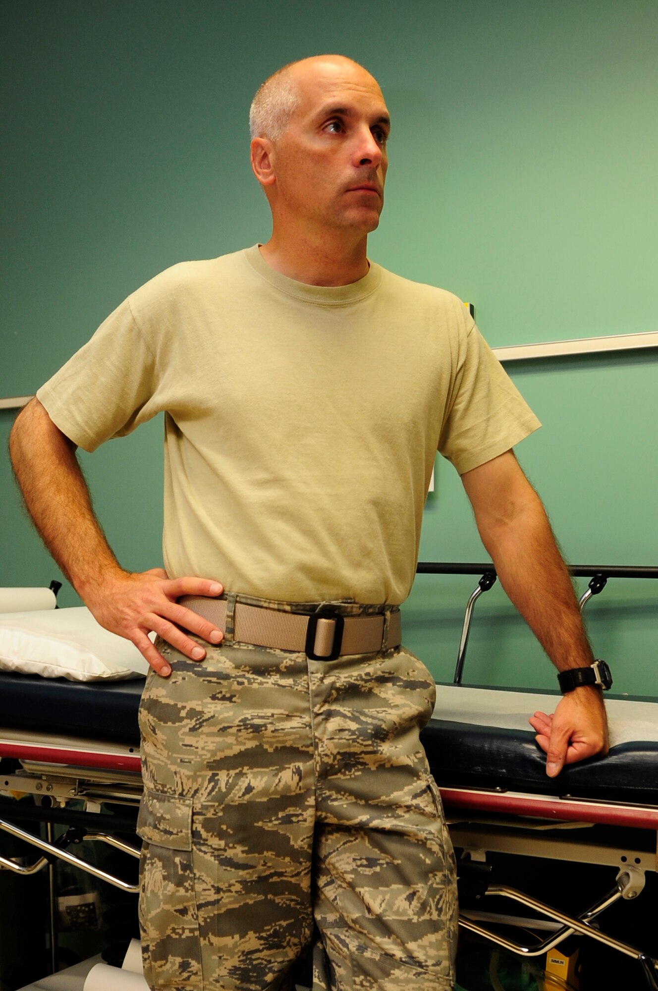 VANDENBERG AIR FORCE BASE, Calif. – Preparing for the influenza vaccine injection, Col. Richard Boltz, the 30th Space Wing commander, listens to the medical brief at the medical clinic here Tuesday, Sept. 13, 2011. The influenza vaccine is available to all active-duty members. (U.S. Air Force photo/Senior Airman Lael Huss)