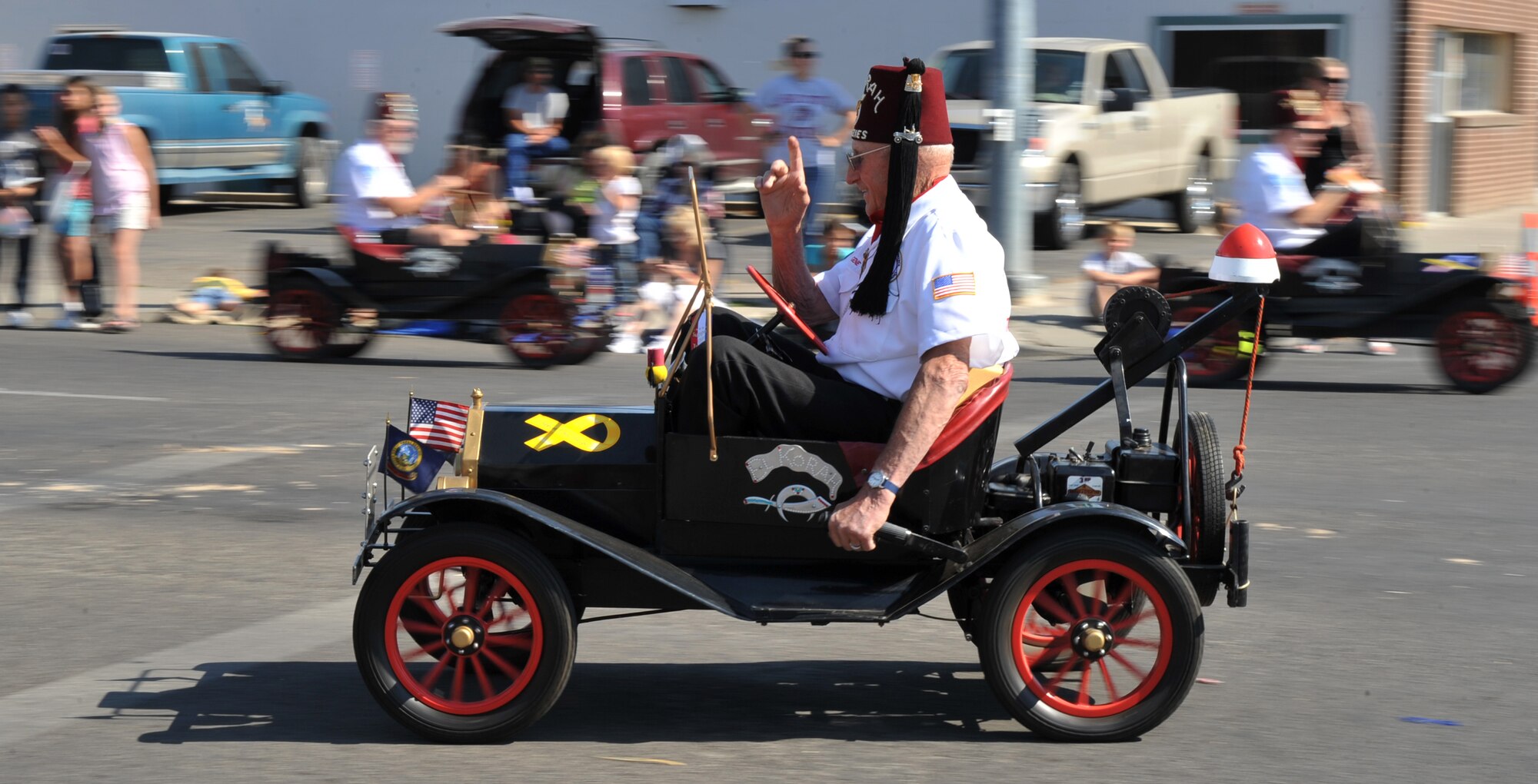 MOUNTAIN HOME, Idaho – A member of the El Korah Shriners from Boise, Idaho, drives a Magic Mini in the Air Force Appreciation Day parade here, Sept. 10. Shriners hospitals Provide the highest quality care to children with neuromusculoskeletal conditions, burn injuries and various other special health care needs. (U.S. Air Force photo by Airman 1st Class Heather Hayward)