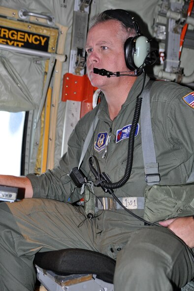 Master Sgt. Scott Blair, a weather reconnaissance loadmaster with the 53rd Weather Reconnaissance Squadron, checks the computer before preparing to release a parachute-borne sensor known as a dropsonde into Tropical Storm Maria Sept. 9. The dropsonde measures and encodes weather data down to the ocean surface. (U.S. Air Force photo by Staff Sgt. Valerie Smock)