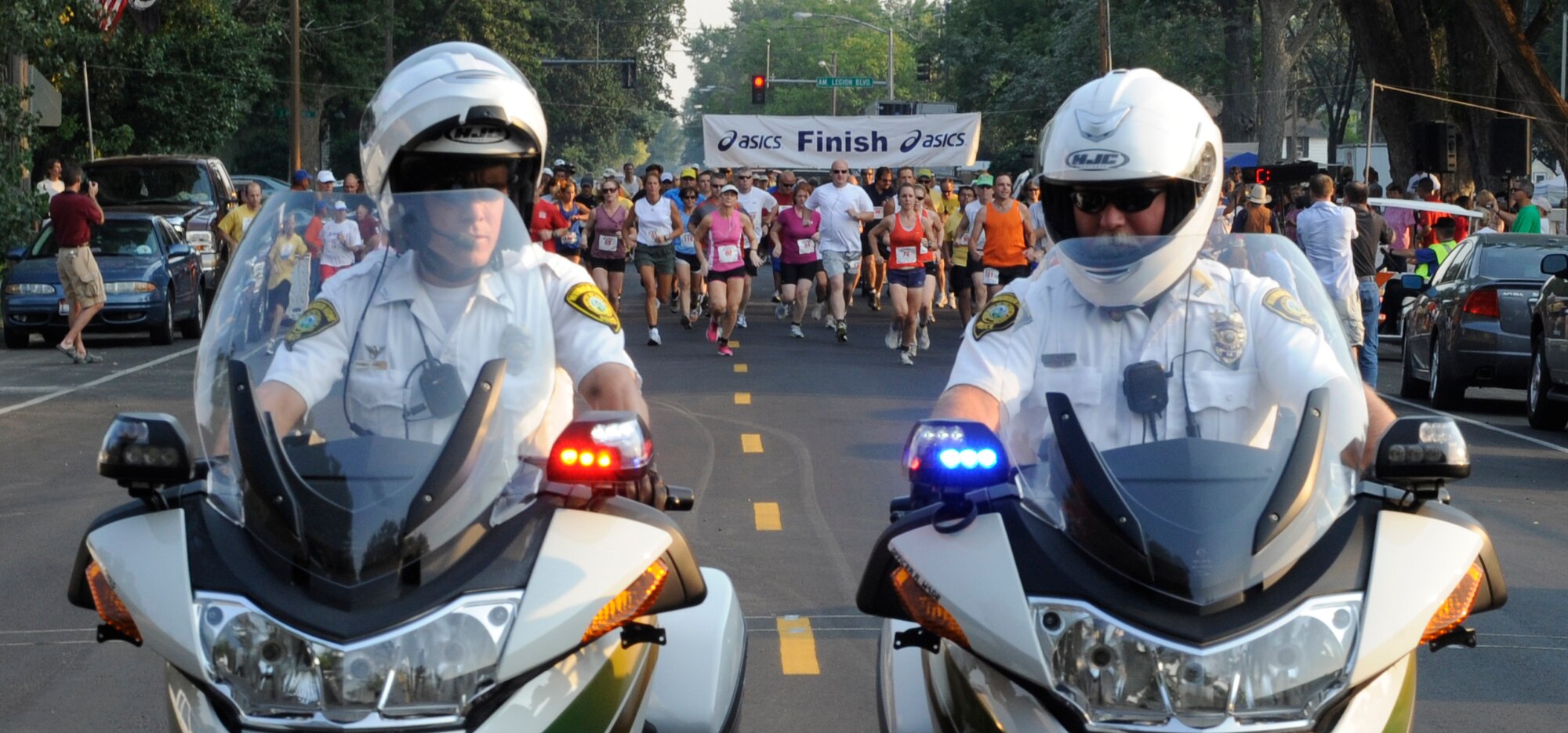 MOUNTAIN HOME, Idaho – Runners participating in the Air Force Appreciation Day Fun Run are escorted by Mountain Home police here, Sept. 9. The run helped kick off the 51st Annual AFAD. (U.S. Air Force photo by Senior Airman Angelina Drake)