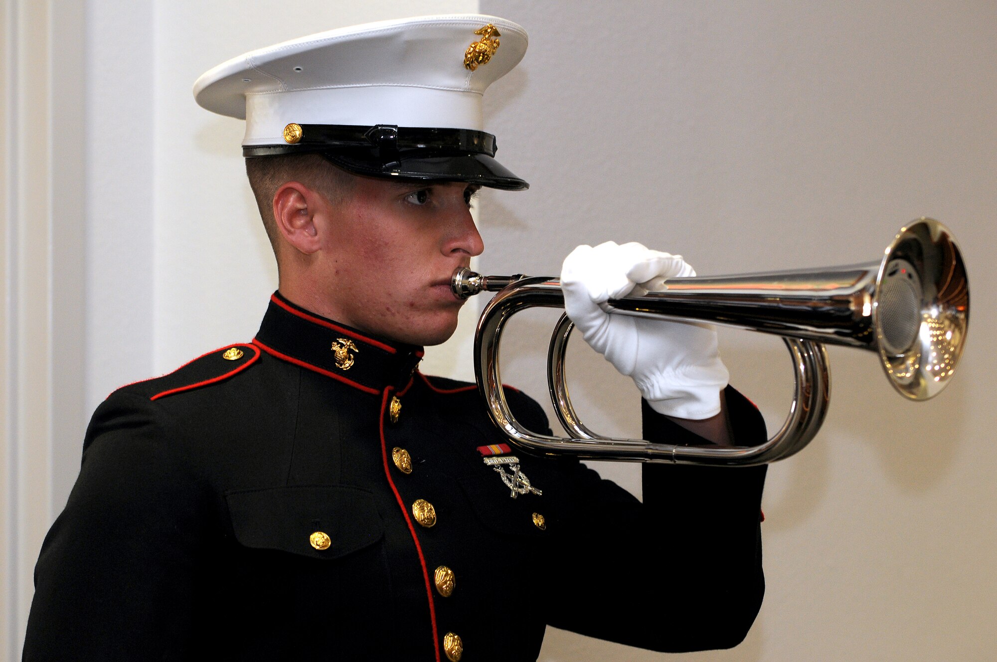 GOODFELLOW AIR FORCE BASE, Texas – Marine Pvt. Joseph Arruda plays taps during the “9/11 A Decade of Remembrance” memorial service at the Chapel here Sept. 12. The ceremony honored those who died in the Sept. 11, 2001, attacks, and the U.S. casualties from the war on terror. (U.S. Air Force Photo /Senior Airman Heather L. Rodgers)