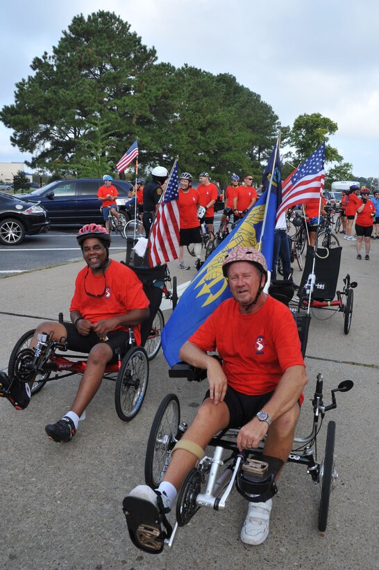 Retired U.S. Air Force Staff Sgt. Chris Semple and retired U.S. Navy Petty Officer 1st Class Ron Mayfield take a break during the Warrior Ride 9/11 Tribute Chesapeake Community Challenge at Joint Expeditionary Base Little Creek-Fort Story, Va., Sept. 9, 2011. Mayfield organizes Warrior Rides for Virginia and is the Adaptive Sports Coordinator for the Warrior Ride. (U.S. Air Force photo by Airman 1st Camilla Griffin/Released)