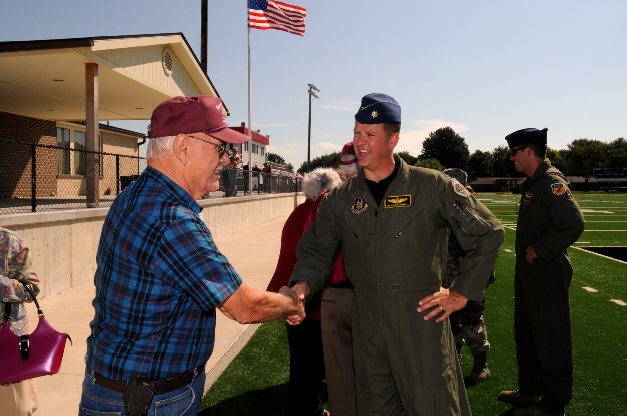 Lt. Col. Preston McConnell (right) speaks to veterans after an assembly at Lincoln High School, Lincoln, Mo., Sept. 9, 2011. During the 9/11 remembrance ceremony, McConnell, an A-10 Thunderbolt II pilot, spoke about freedom and remembering 9/11 to nearly 500 students, administrators and local community members. McConnell is part of the 303rd Fighter Squadron of the 442nd FW, an Air Force Reserve unit at Whiteman Air Force Base, Mo. (U.S. Air Force photo/ Senior Airman Wesley Wright)