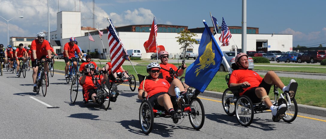 Warrior Ride 9/11 Tribute Chesapeake Community Challenge participants ride through Naval Station Norfolk, Va., Sept. 9, 2011.The goal of the annual ride is to raise awareness of and support for wounded servicemembers and their families. (U.S. Air Force photo by Airman 1st Class Teresa Cleveland/Released)