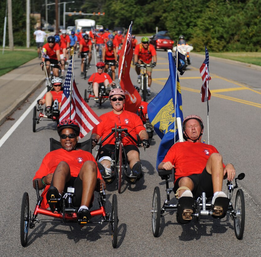 Retired U.S. Air Force Staff Sgt. Chris Semple, retired Senior Master Sgt. Rainier Schroeder, and retred U.S. Navy Petty Officer 1st Class Ron Mayfield lead the pack during the Warrior Ride 9/11 Tribute Chesapeake Community Challenge through Norfolk, Va., Sept. 9, 2011. The ride is a two-day event that serves as a tool for recreation and rehabilitation for wounded servicemembers. (U.S. Air Force photo by Airman 1st Class Teresa Cleveland/Released)