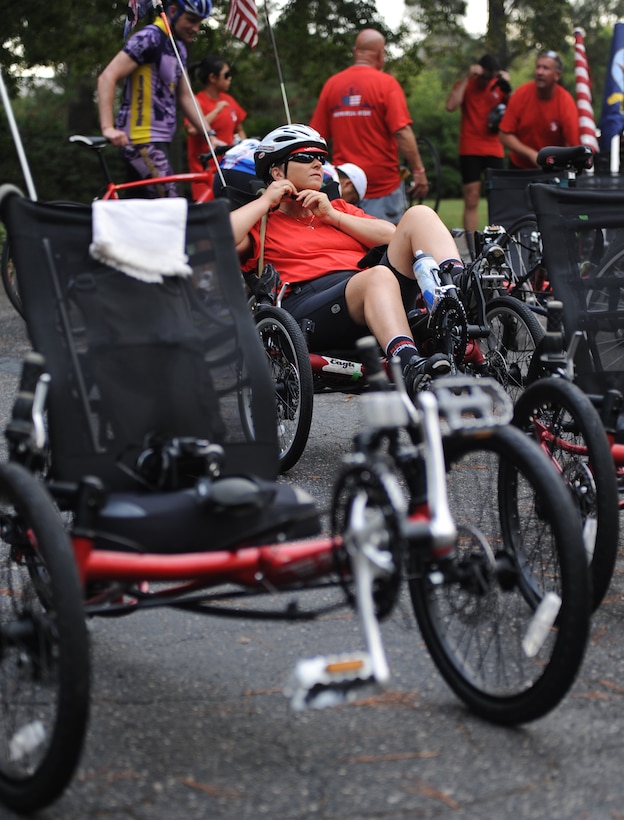 Retired U.S. Army Master Sgt. Marina Libro fastens her helmet before departing on the Warrior Ride 9/11 Tribute Chesapeake Community Challenge in Norfolk, Va., Sept 9, 2011. The ride covered 46 miles over 2 days through Norfolk and Chesapeake. (U.S. Air Force photo by Airman 1st Class Teresa Cleveland/Released)