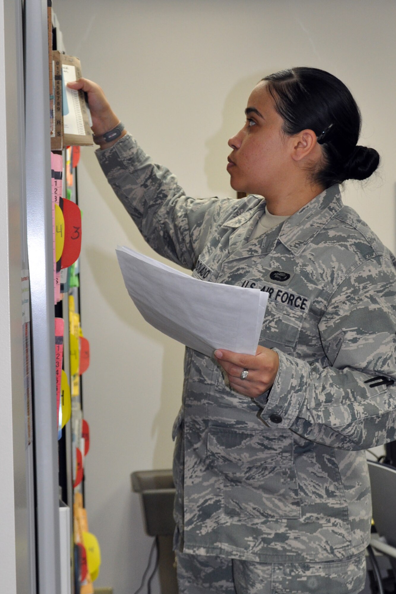 YOUNGSTOWN AIR RESERVE STATION, Ohio -- Air Force Reserve Tech. Sgt. Natalie Maldonado, a dental technician with the 910th Medical Squadron files DD Form 2813s, the civilian dental examination form, in the dental records of military members assigned to the 910th Airlift Wing, based here, September 12, 2011. The purpose of the form is to aid Citizen Airmen to work with their civilian dentists to maintain good dental health between visits to the 910th MDS military dentists. Visits to the military dentist are required every three years for unit members as part of their medical requirements. U.S. Air Force photo by Master Sgt. Bob Barko Jr.   