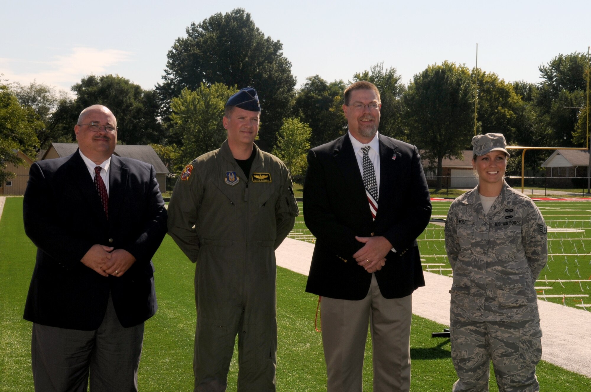 Mr. Ronald Griffith, lead pastor of First Baptist Church, Lincoln, Mo., Lt. Col. Preston McConnell, 303rd Fighter Squadron A-10 Thunderbolt II pilot, Mr. Mark Spunaugle, and Staff Sgt. Danielle Wolf, 442nd Fighter Wing Public Affairs specialist, spoke to students on the football field at Lincoln High School at a 9/11 remembrance ceremony, Sept. 9, 2011. During the assembly, McConnell and Wolf, both of Whiteman Air Force Base, Mo., spoke about freedom and remembering 9/11 to nearly 500 students, administrators and local community members. The 442nd FW is an Air Force Reserve unit at Whiteman. (U.S. Air Force photo/ Senior Airman Wesley Wright)