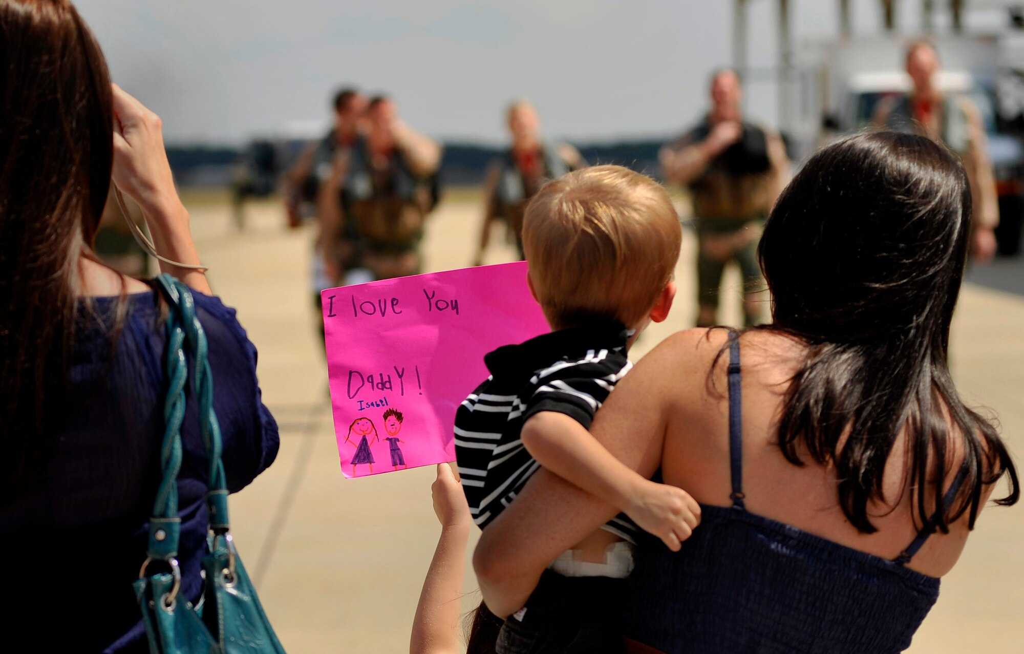 Families of U.S. Air Force F-16 Fighting Falcon pilots assigned to the 77th Fighter Squadron welcome home their loved ones upon their return from a five month deployment in support of Operation Unified Protector, Sept. 12, 2011, Shaw Air Force Base, S.C. The mission of the 77th FS pilots was to provide air suppression and destruction of enemy defenses. (U.S. Air Force photo by Senior Airman Kenny Holston/Released)


